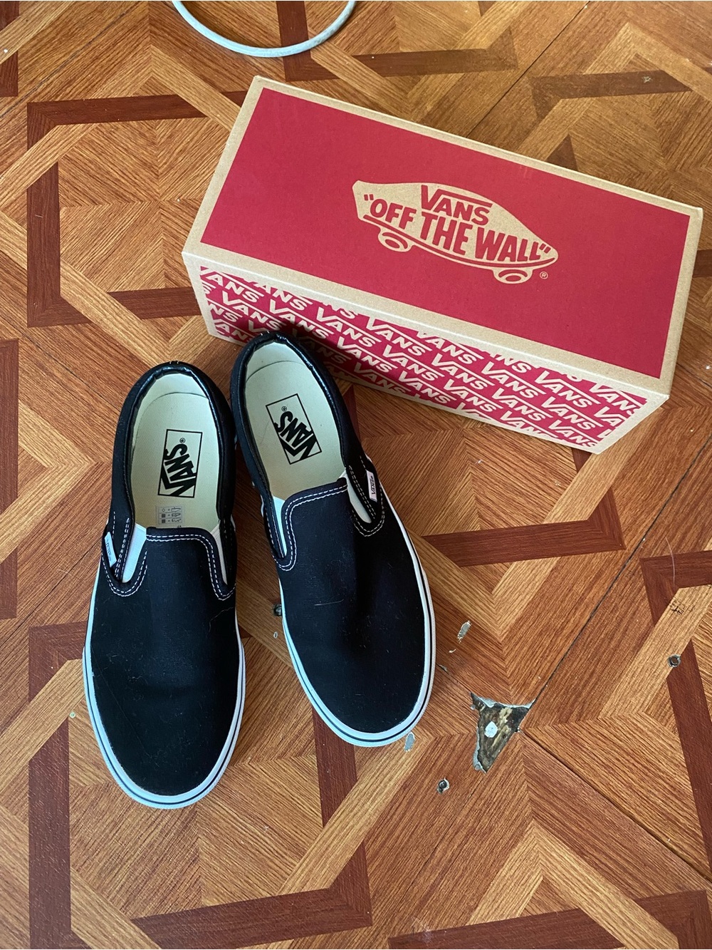 Vans Black and White Slip-On Sneakers